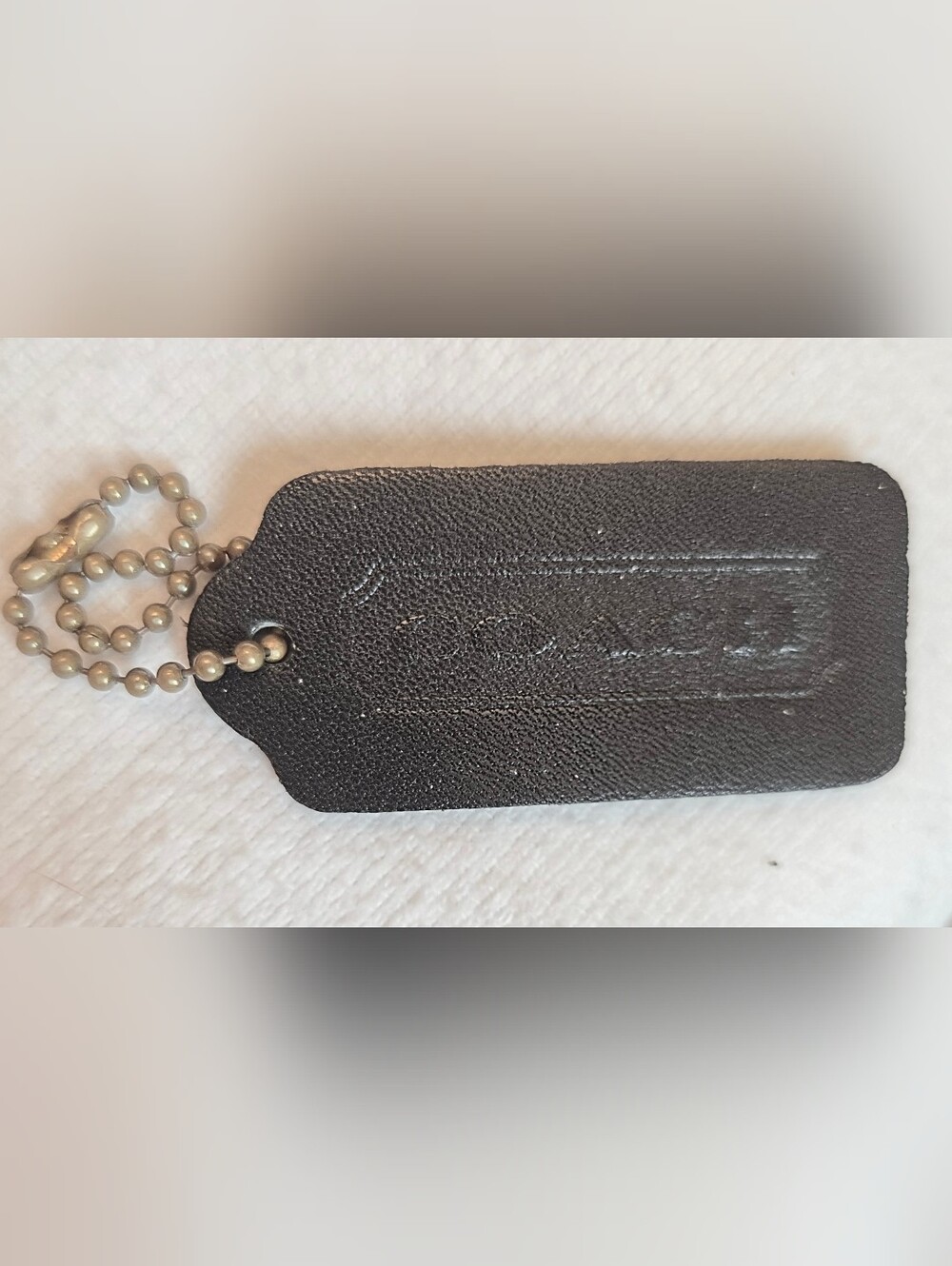 COACH Vintage 2¼" x 1" Hang Tag Black Leather double sided embosed key chain.